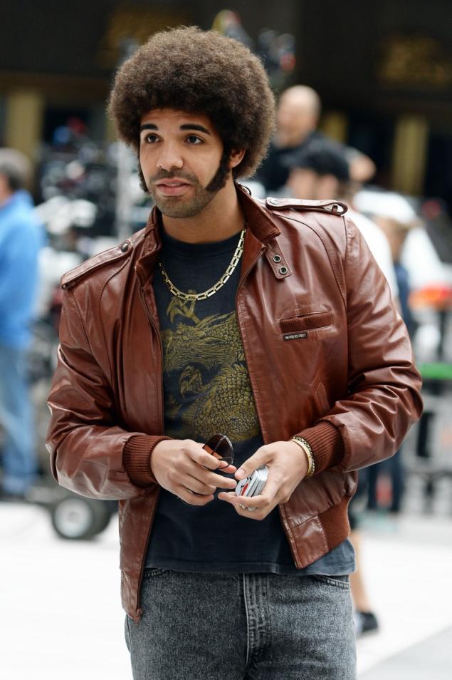 Drake on the set of Anchorman 2 in 1977-era garb (DOUG MESZLER / SPLASH NEWS/DOUG MESZLER / SPLASH NEWS)