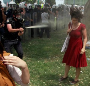 "Woman in Red" image that caught international attention to the unrest (Credit: Reuters)