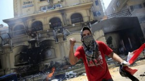 Demonstrators attacked the Muslim Brotherhood headquarters in Cairo on Monday. (Credit: AP)